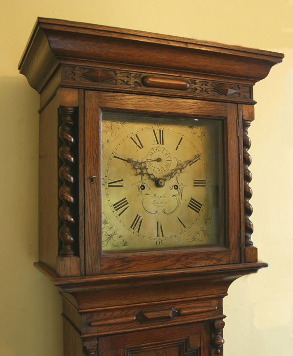 Longcase clock, Maple of London, view of the top